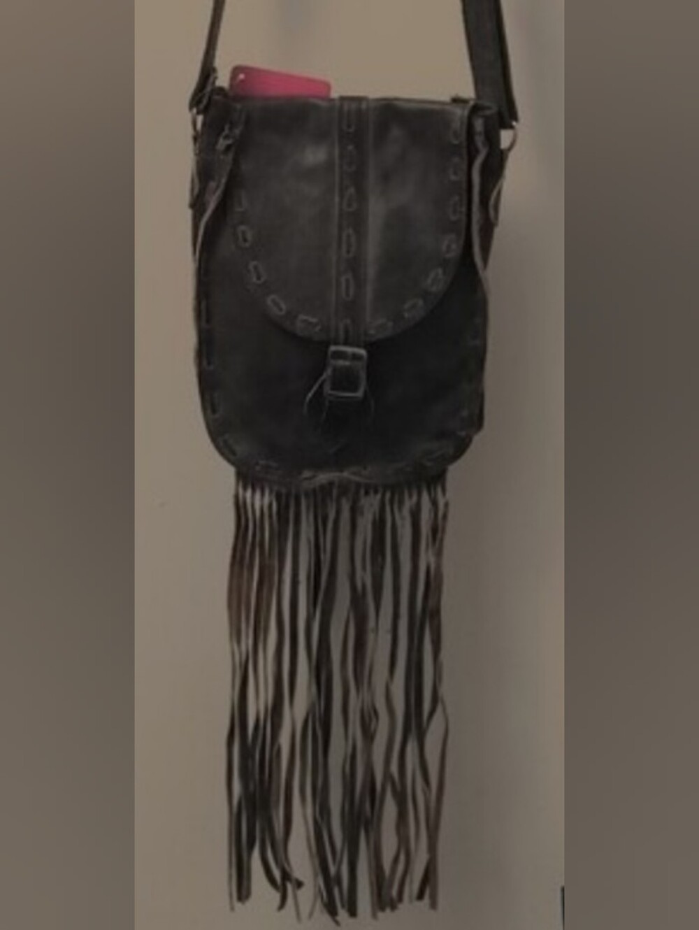 Women's Brown Fringe Leather Crossbody Bag with Magnetic Closure.